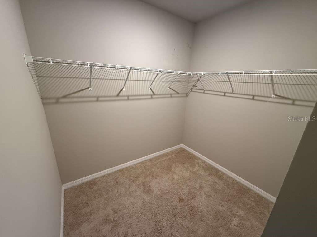 1788 Carnostie Road Winter Haven, FL 33884 - Photo 14 of 17 a view of a room with racks on the wall