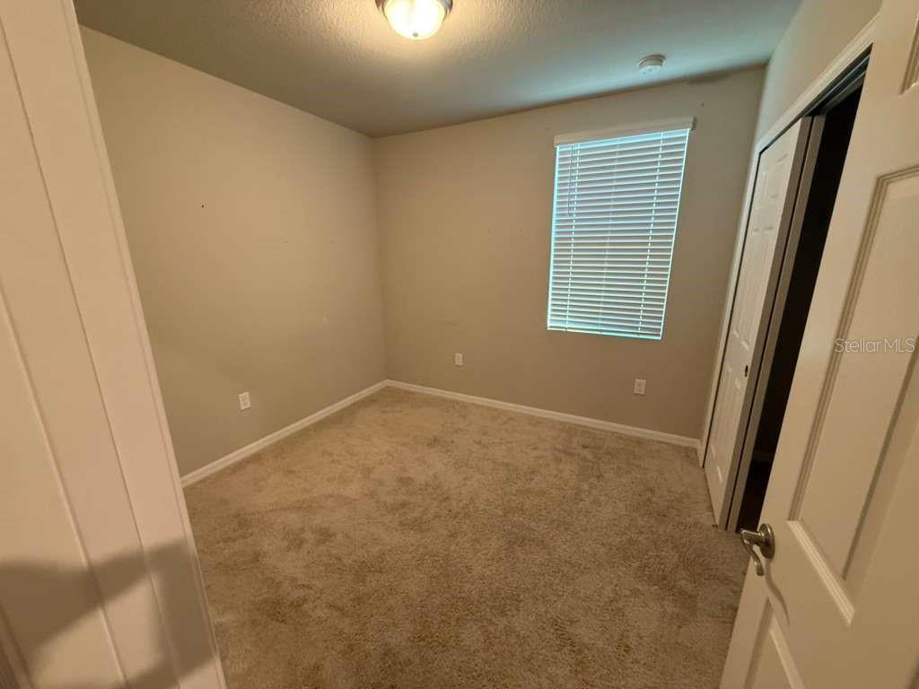 1788 Carnostie Road Winter Haven, FL 33884 - Photo 8 of 17 an empty room with a window