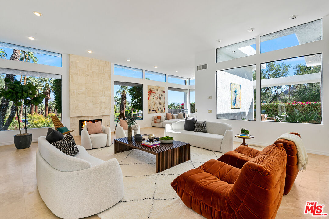 70551 Placerville Road Rancho Mirage, CA 92270 - Photo 2 of 42 a living room with furniture and a large window