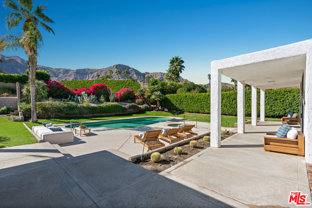 70551 Placerville Road Rancho Mirage, CA 92270 - Photo 16 of 42 a view of yard with seating area and car parked