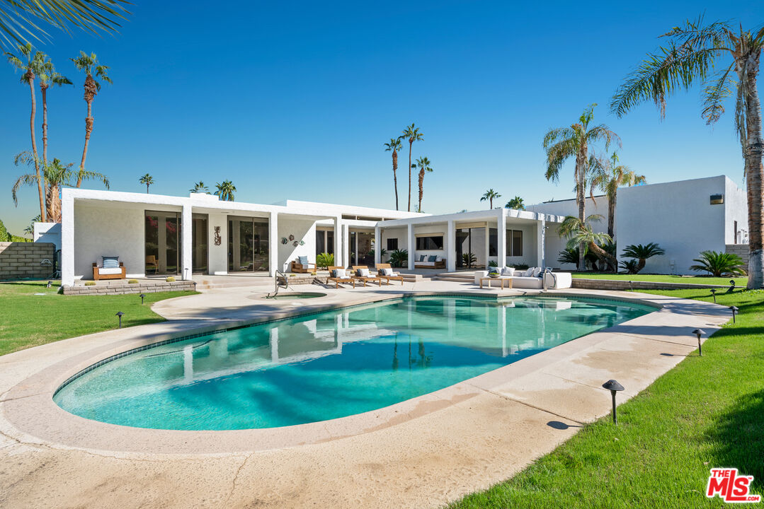 70551 Placerville Road Rancho Mirage, CA 92270 - Photo 18 of 42 a view of a house with a swimming pool