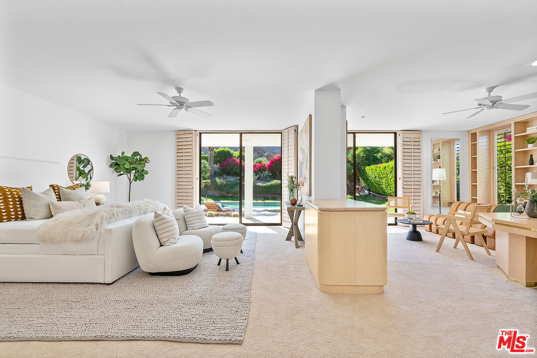 70551 Placerville Road Rancho Mirage, CA 92270 - Photo 20 of 42 a living room with furniture and large windows