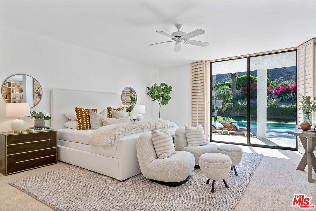 70551 Placerville Road Rancho Mirage, CA 92270 - Photo 21 of 42 a bedroom with furniture and a large window