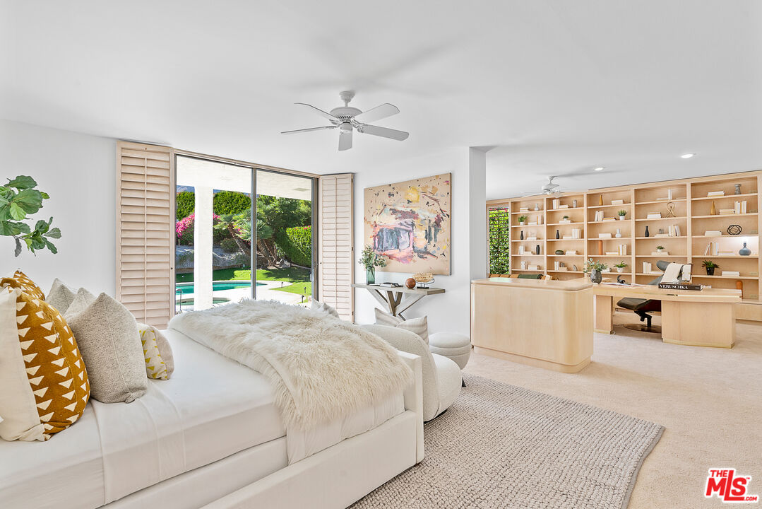 70551 Placerville Road Rancho Mirage, CA 92270 - Photo 22 of 42 a bedroom with a large bed and a large window