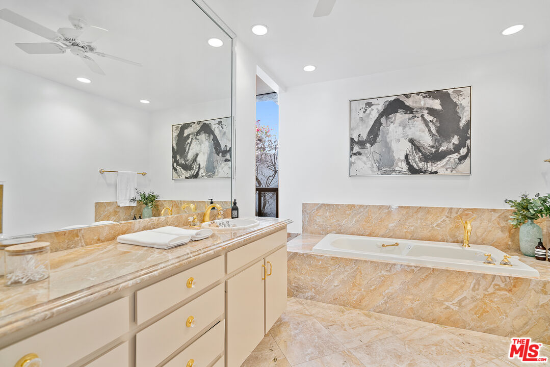 70551 Placerville Road Rancho Mirage, CA 92270 - Photo 25 of 42 a spacious bathroom with a bathtub and a shower