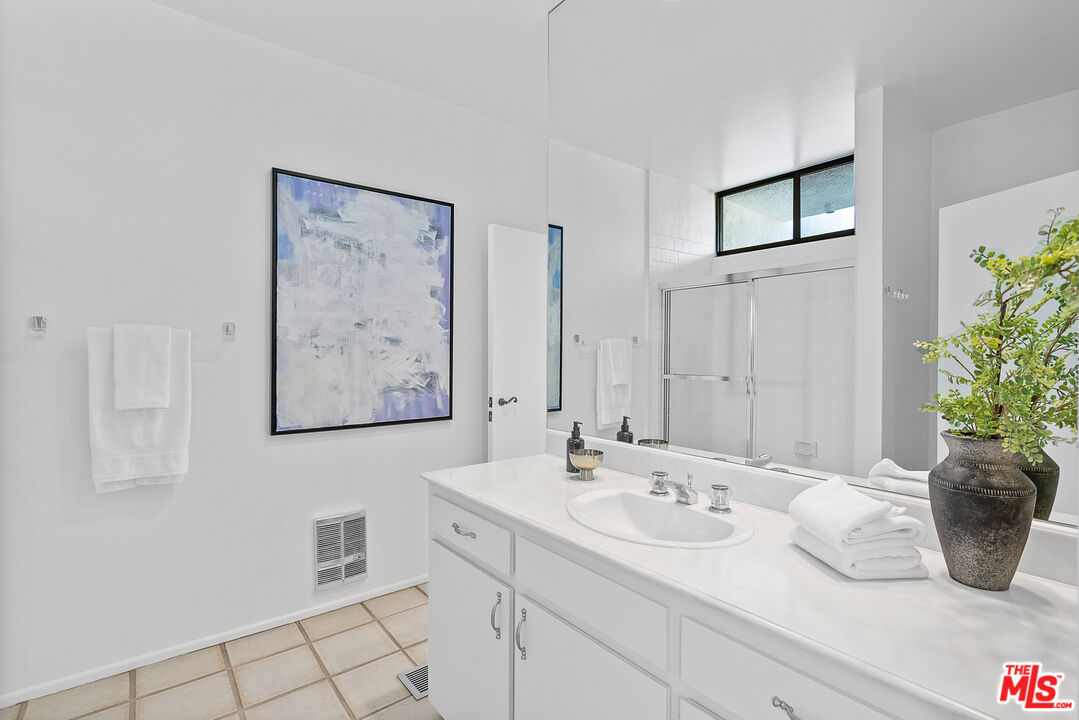 70551 Placerville Road Rancho Mirage, CA 92270 - Photo 30 of 42 a bathroom with a sink a toilet and mirror