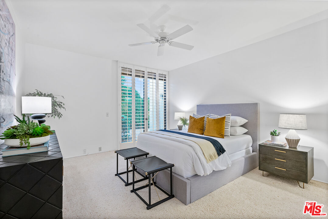 70551 Placerville Road Rancho Mirage, CA 92270 - Photo 31 of 42 a spacious bedroom with a bed and a couch