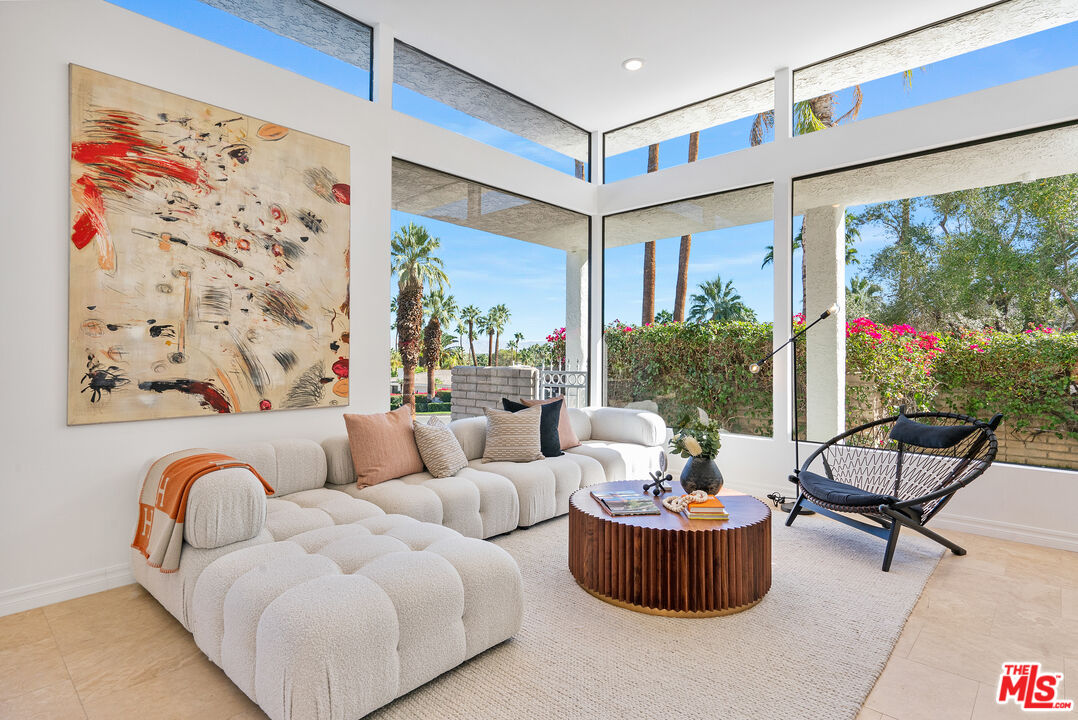 70551 Placerville Road Rancho Mirage, CA 92270 - Photo 7 of 42 a living room with furniture and a large window