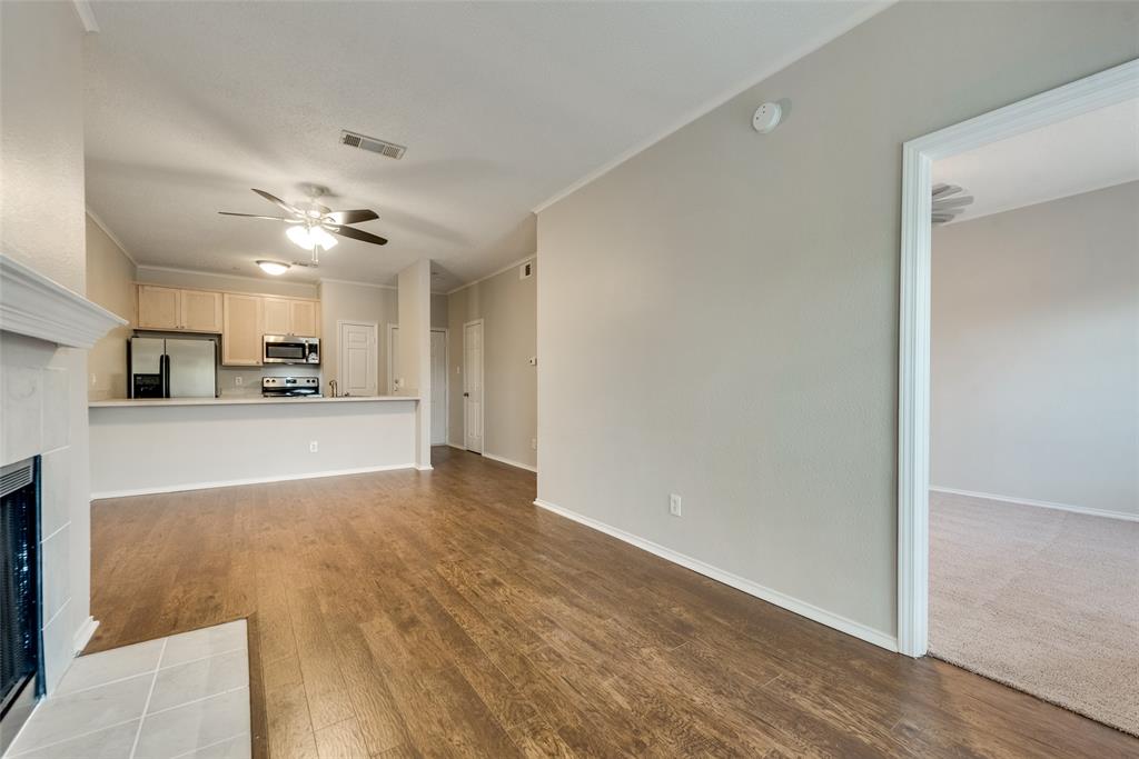 6003 Oram Street, Unit 104 Dallas, TX 75206 - Photo 1 of 1 a view of a kitchen with a sink and a refrigerator