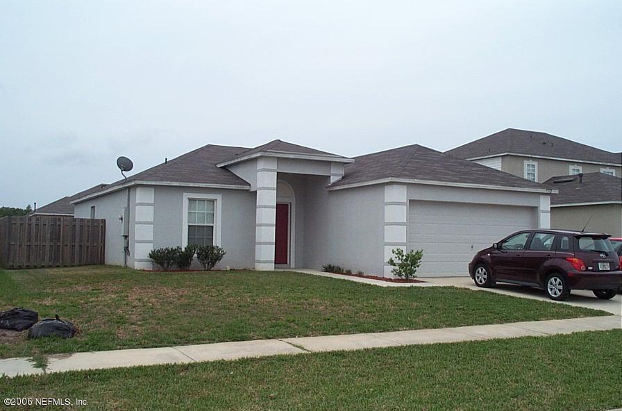 7372 Spring Hill Road Jacksonville, FL 32244 - Photo 1 of 1 a view of a yard in front of a house
