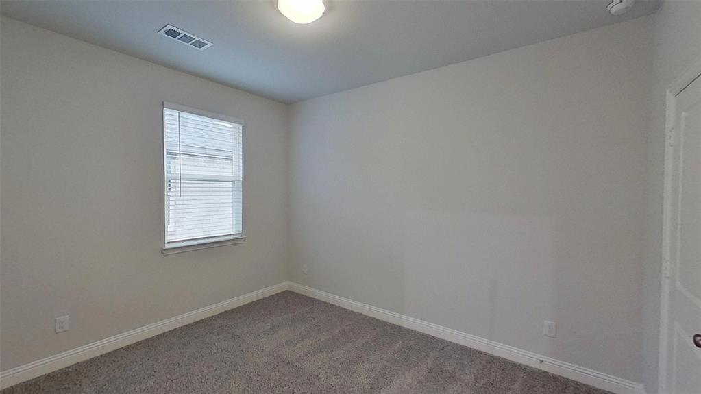 415 Magellan Road Seagoville, TX 75159 - Photo 11 of 12 an empty room with a window