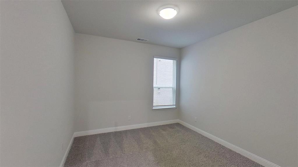 415 Magellan Road Seagoville, TX 75159 - Photo 8 of 12 an empty room with a window