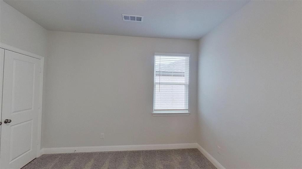 415 Magellan Road Seagoville, TX 75159 - Photo 10 of 12 an empty room with a window