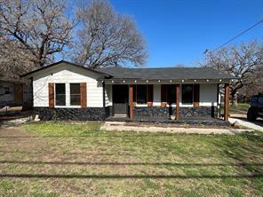 a front view of a house with swimming pool