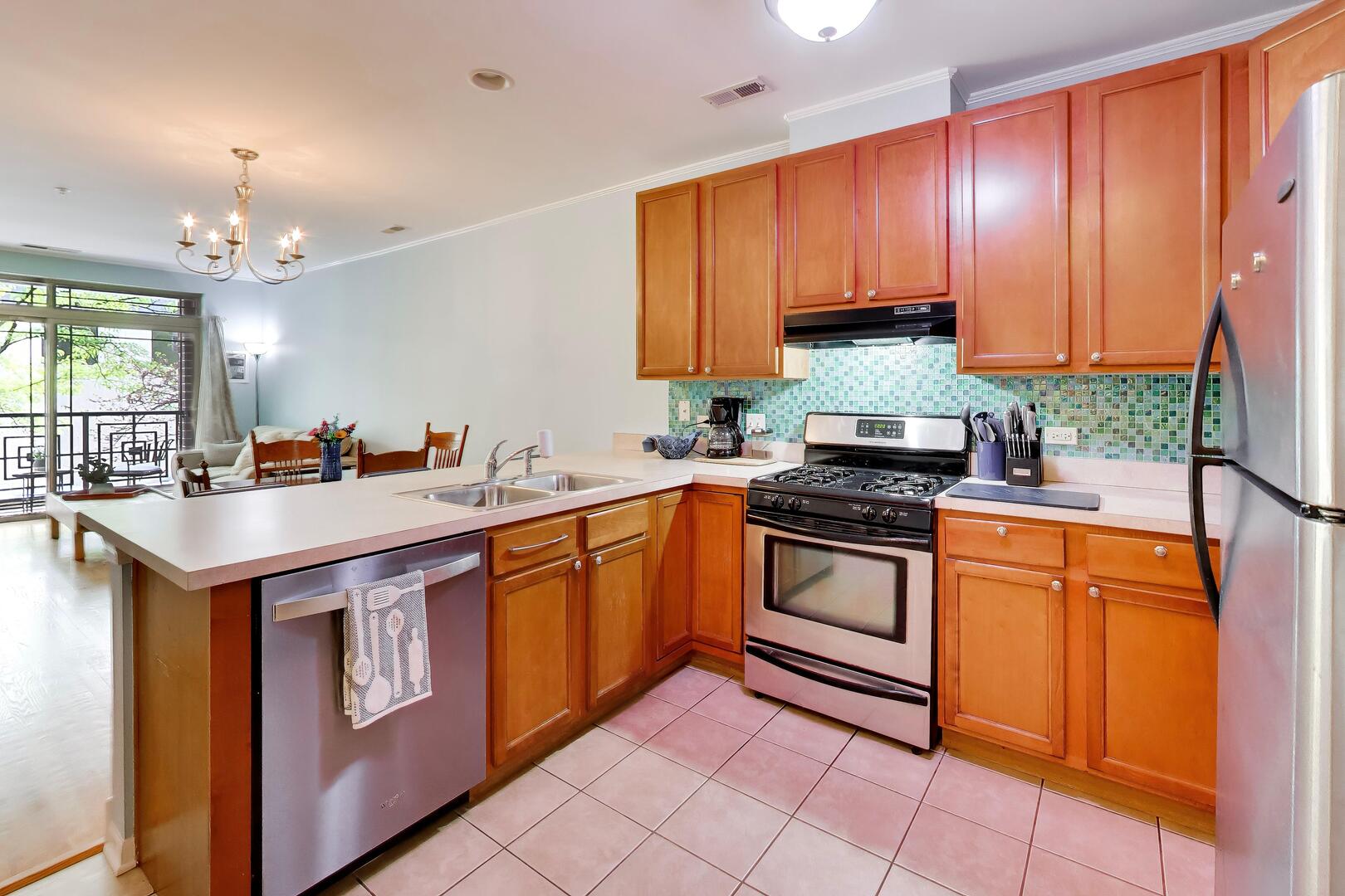 6436 Roosevelt Road, Unit 212 Oak Park, IL 60304 - Photo 5 of 22 a kitchen with stainless steel appliances granite countertop a sink a stove and a refrigerator