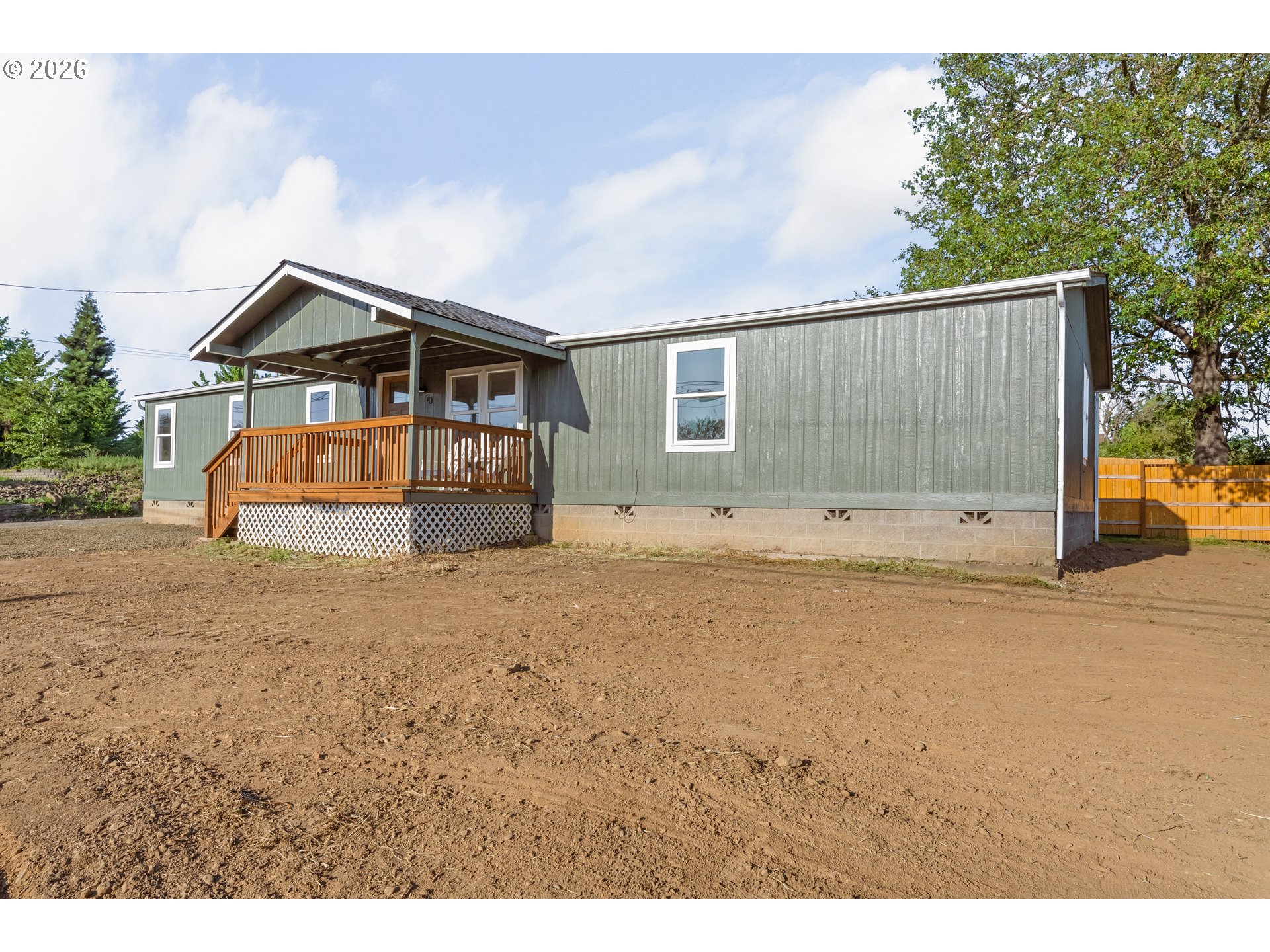 70 Darrell Avenue Winston, OR 97496 - Photo 2 of 39 a front view of a house with a yard and garage