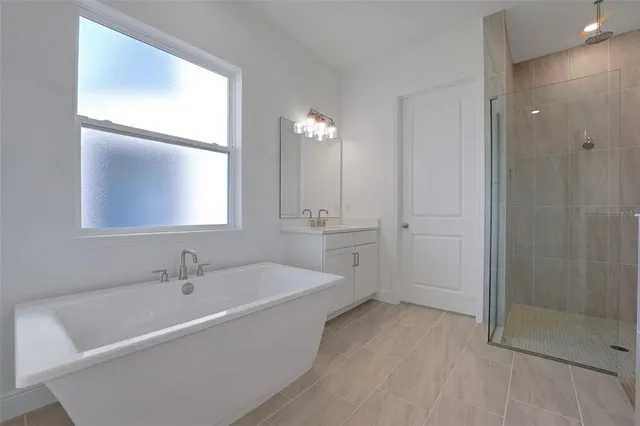 a bathroom with a bathtub and a sink