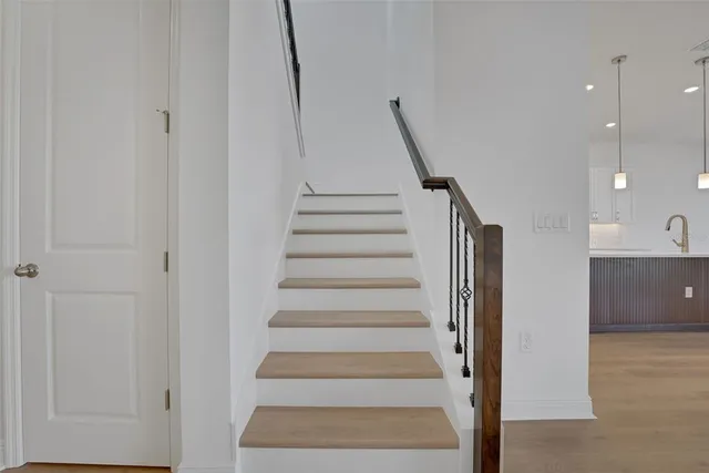 a view of entryway and hall with a bath tub
