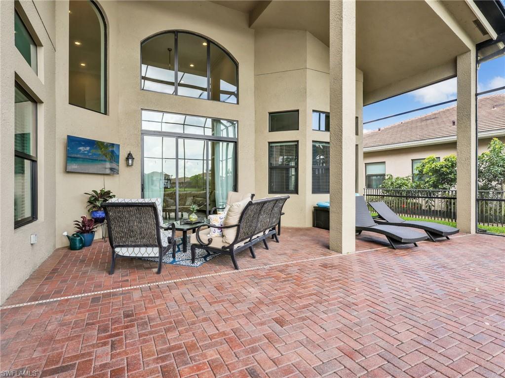 2756 Crystal Way Naples, FL 34119 - Photo 45 of 50 a living room filled with furniture window and a table