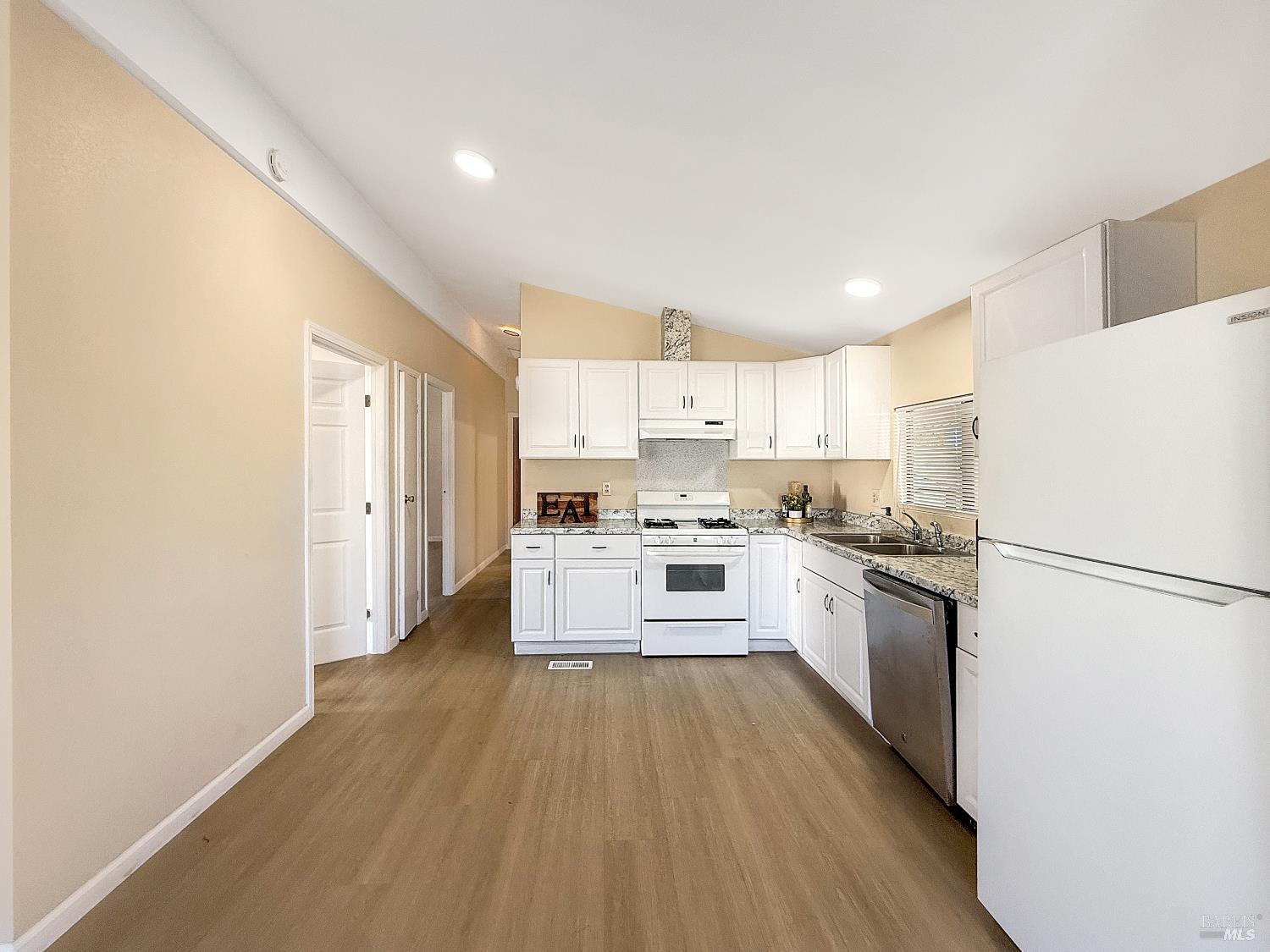 190 Apple Lane Santa Rosa, CA 95407 - Photo 7 of 23 a kitchen with white cabinets and white appliances