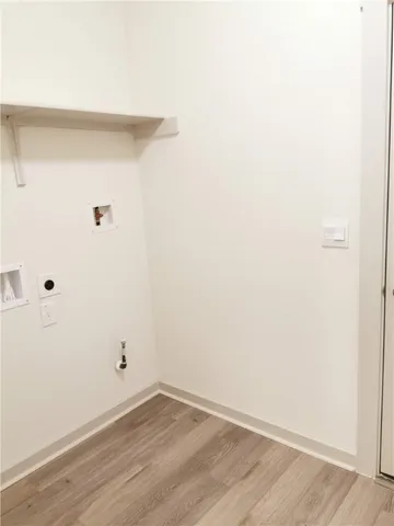 a view of a small space with wooden floor