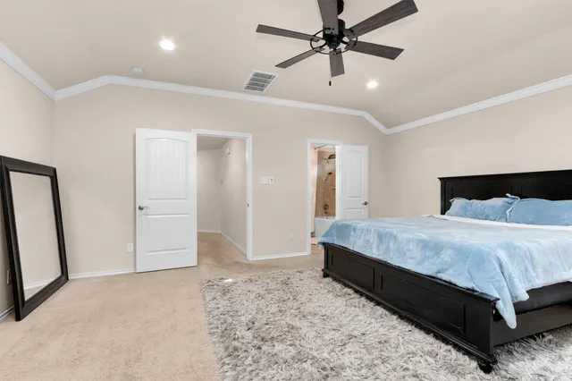 a bedroom with a bed and a mirror