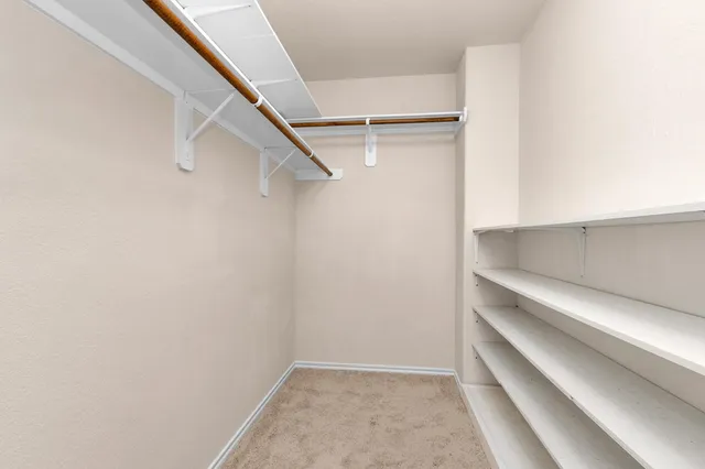 a view of an empty walk in closet