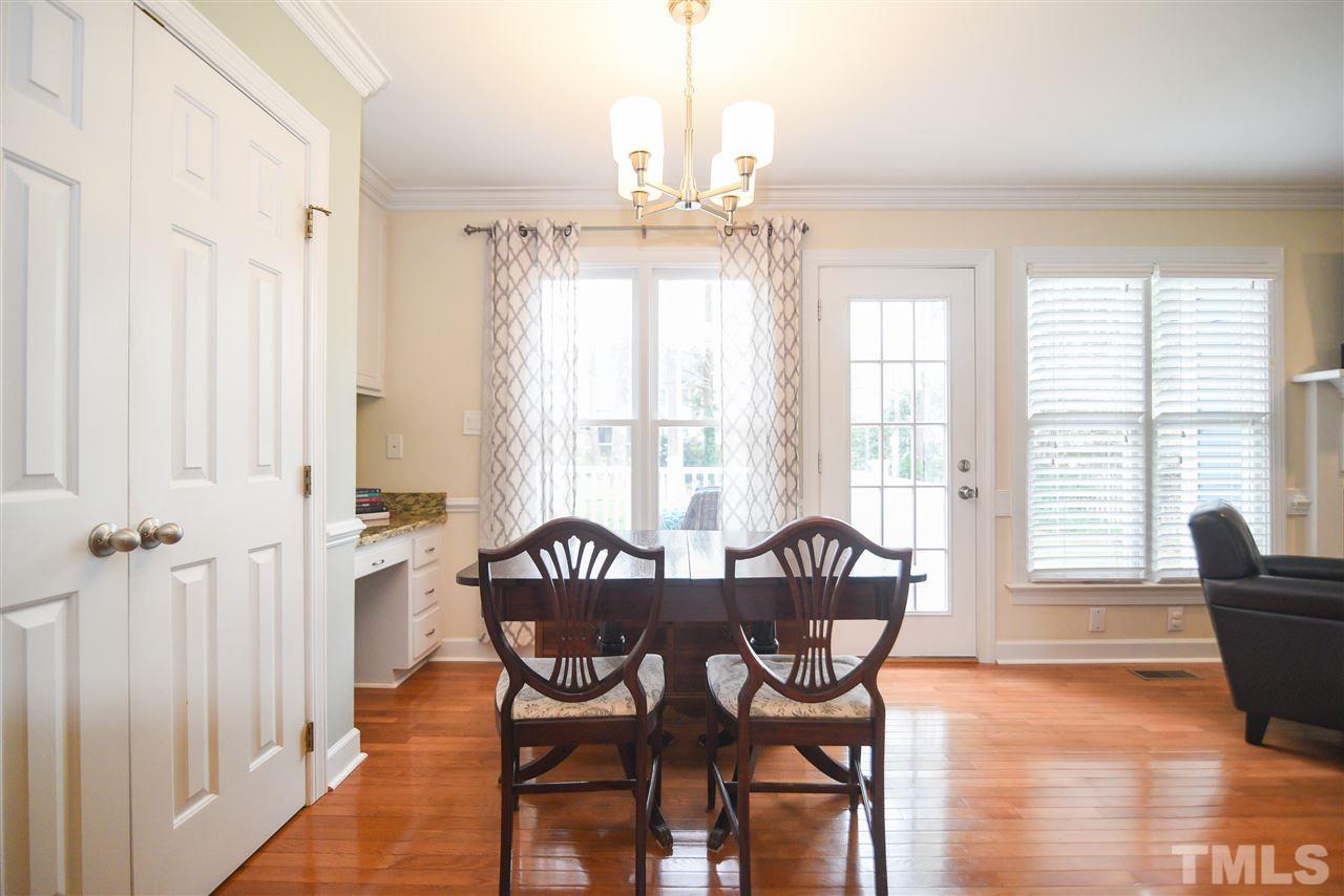 9200 Dawnshire Road Raleigh, NC 27615 - Photo 12 of 30 a view of a dining room with furniture window and wooden floor