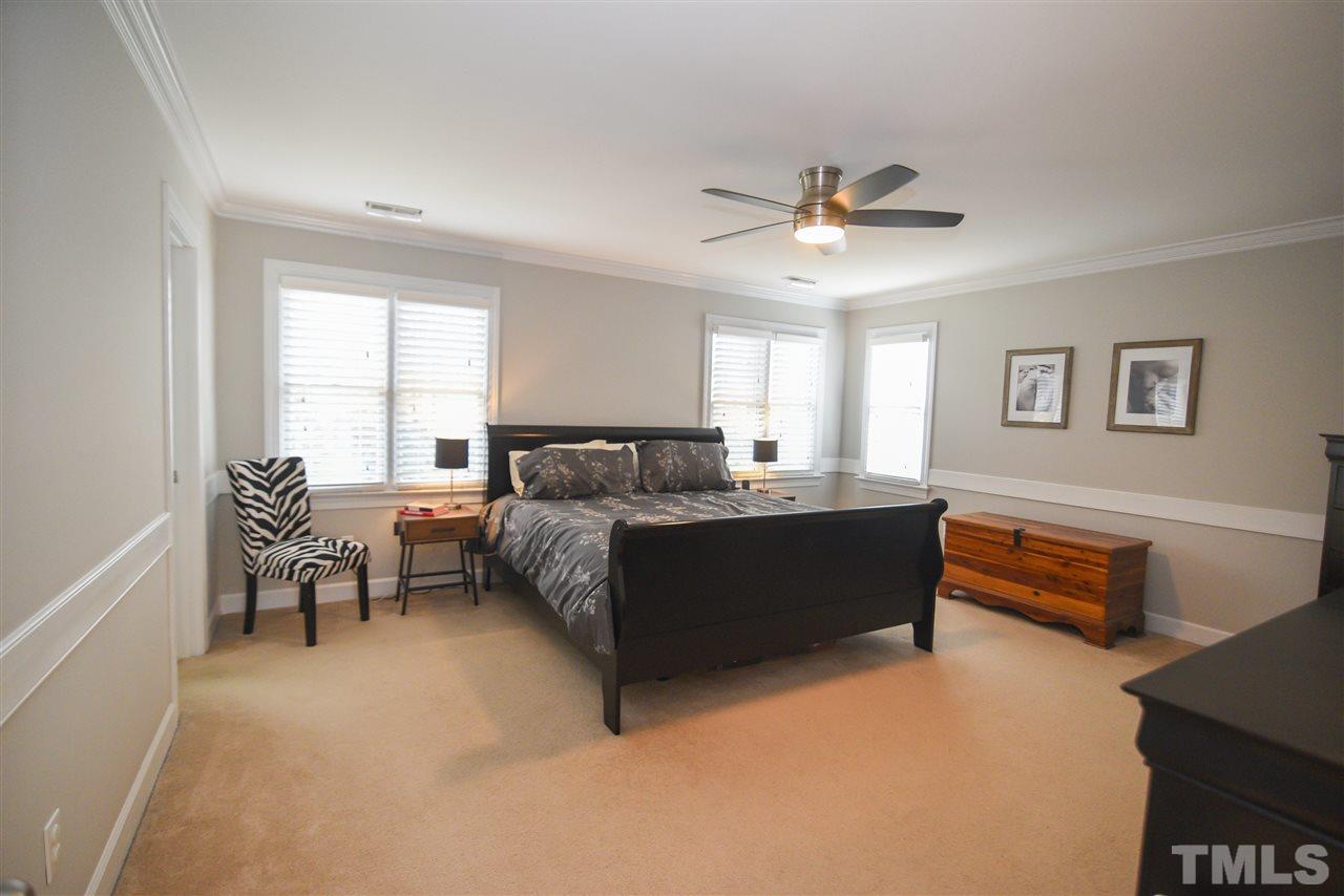 9200 Dawnshire Road Raleigh, NC 27615 - Photo 18 of 30 a living room with furniture and a chandelier