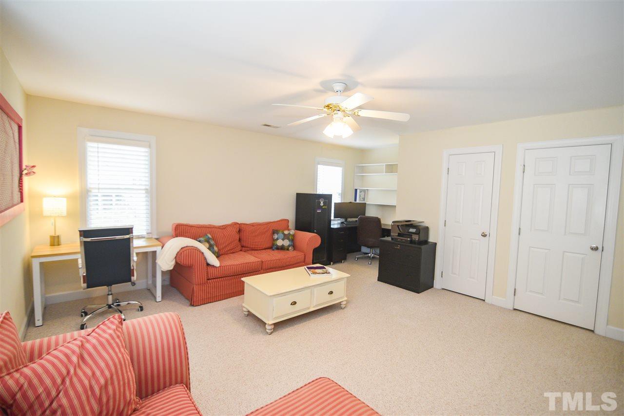 9200 Dawnshire Road Raleigh, NC 27615 - Photo 25 of 30 a living room with furniture ceiling fan and a window
