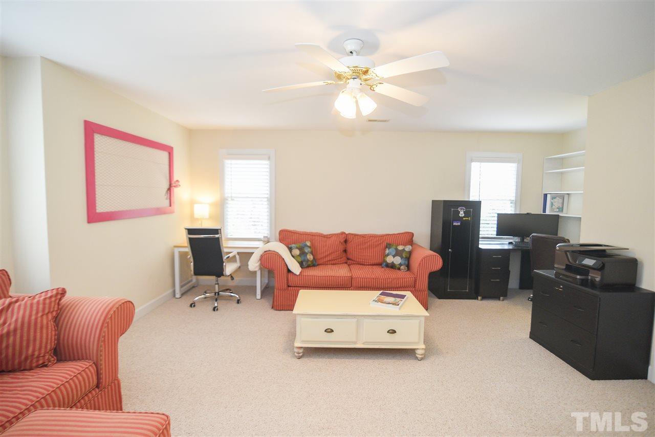 9200 Dawnshire Road Raleigh, NC 27615 - Photo 26 of 30 a living room with furniture and a flat screen tv