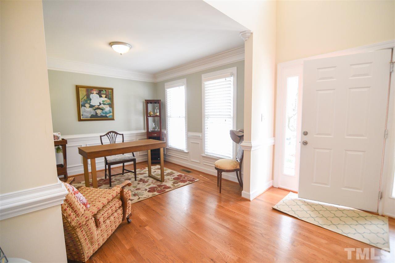 9200 Dawnshire Road Raleigh, NC 27615 - Photo 5 of 30 a living room with furniture and a wooden floor