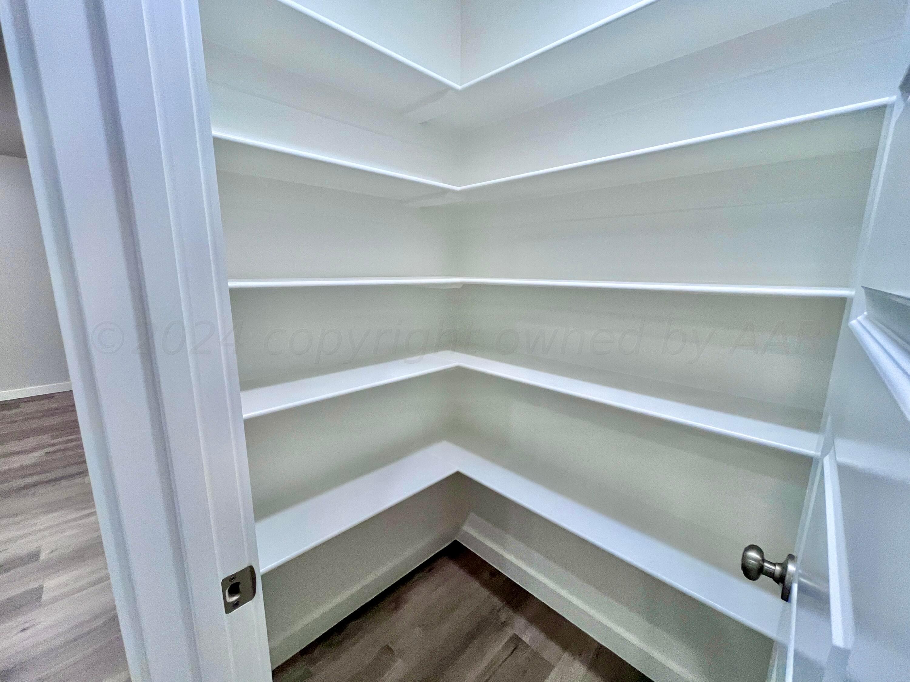 3103 Swenson Street Amarillo, TX 79124 - Photo 8 of 23 a storage room with an empty room