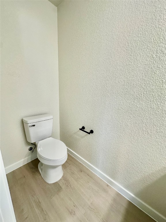 1118 South 51st Street, Unit B Temple, TX 76504 - Photo 11 of 25 a white toilet sitting next to a white sink