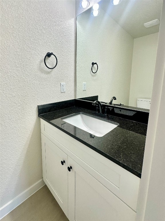 1118 South 51st Street, Unit B Temple, TX 76504 - Photo 12 of 25 a bathroom with a sink and a mirror