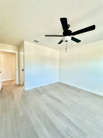 a view of a big room with wooden floor