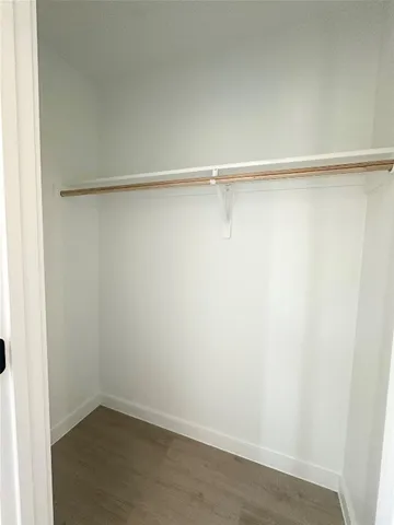 a view of an empty walk in closet