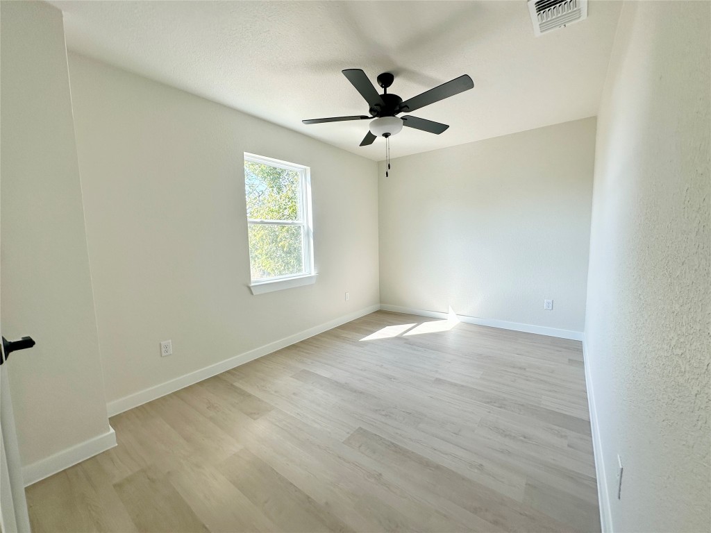 1118 South 51st Street, Unit B Temple, TX 76504 - Photo 18 of 25 an empty room with a window and a fan
