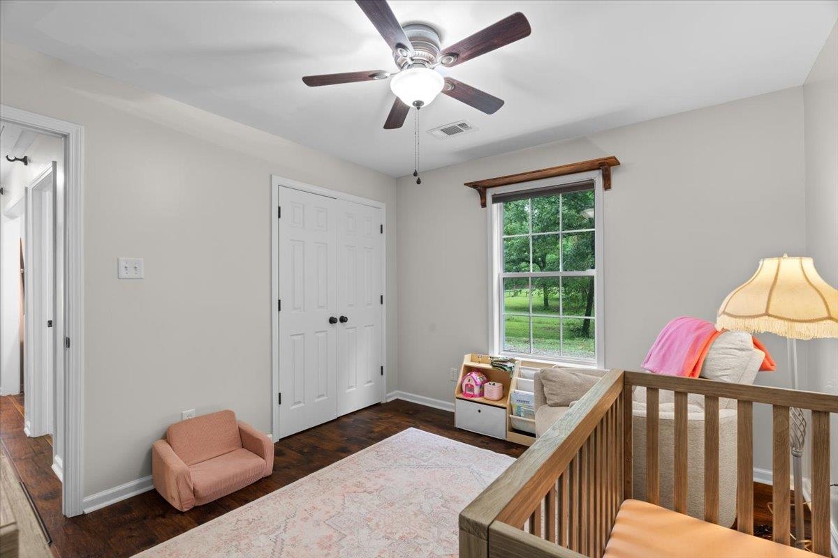 150 Liberty Road Moscow, TN 38057 - Photo 14 of 36 Room with wood-finish flooring, light neutral wall paint, and a ceiling fan with light fixture