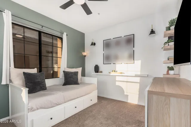 a living room with a flat screen tv