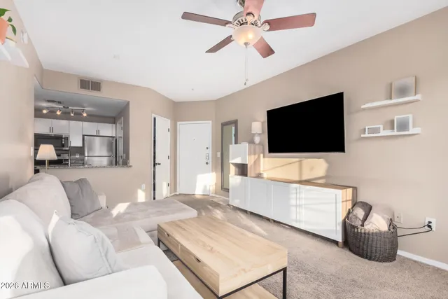 a kitchen with a refrigerator stove and cabinets