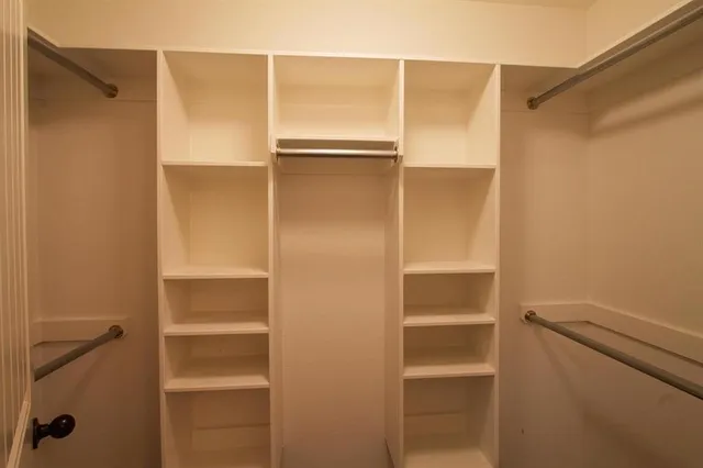 a bathroom with a walk in closet