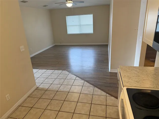 a view of an empty room and window