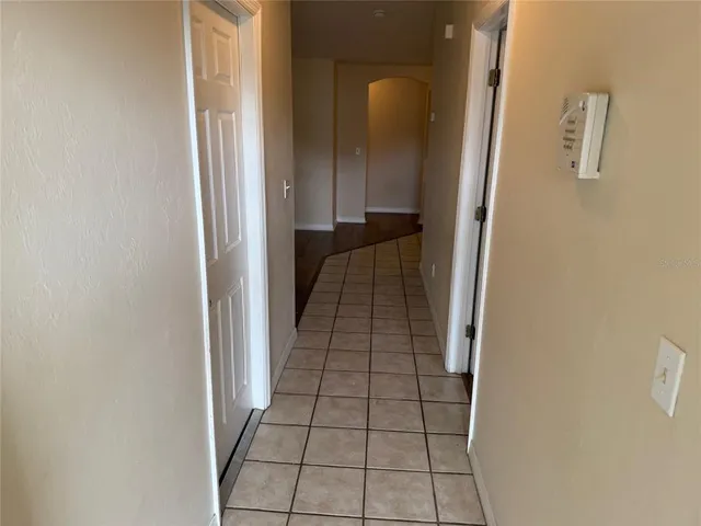 a view of hallway with wooden floor