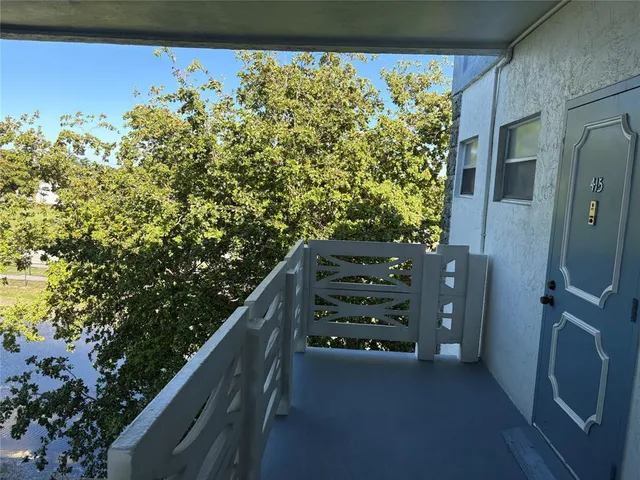 a view of balcony with wooden floor