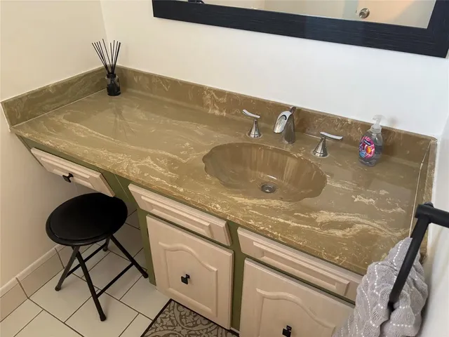 a view of a small space with wooden floor and a window