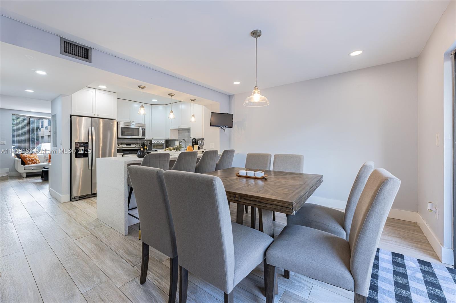 10037 Southwest 77th Court Miami, FL 33156 - Photo 14 of 70 a view of a dining room with furniture