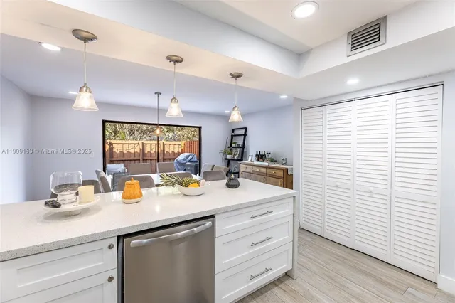 a view of a patio with table and chairs