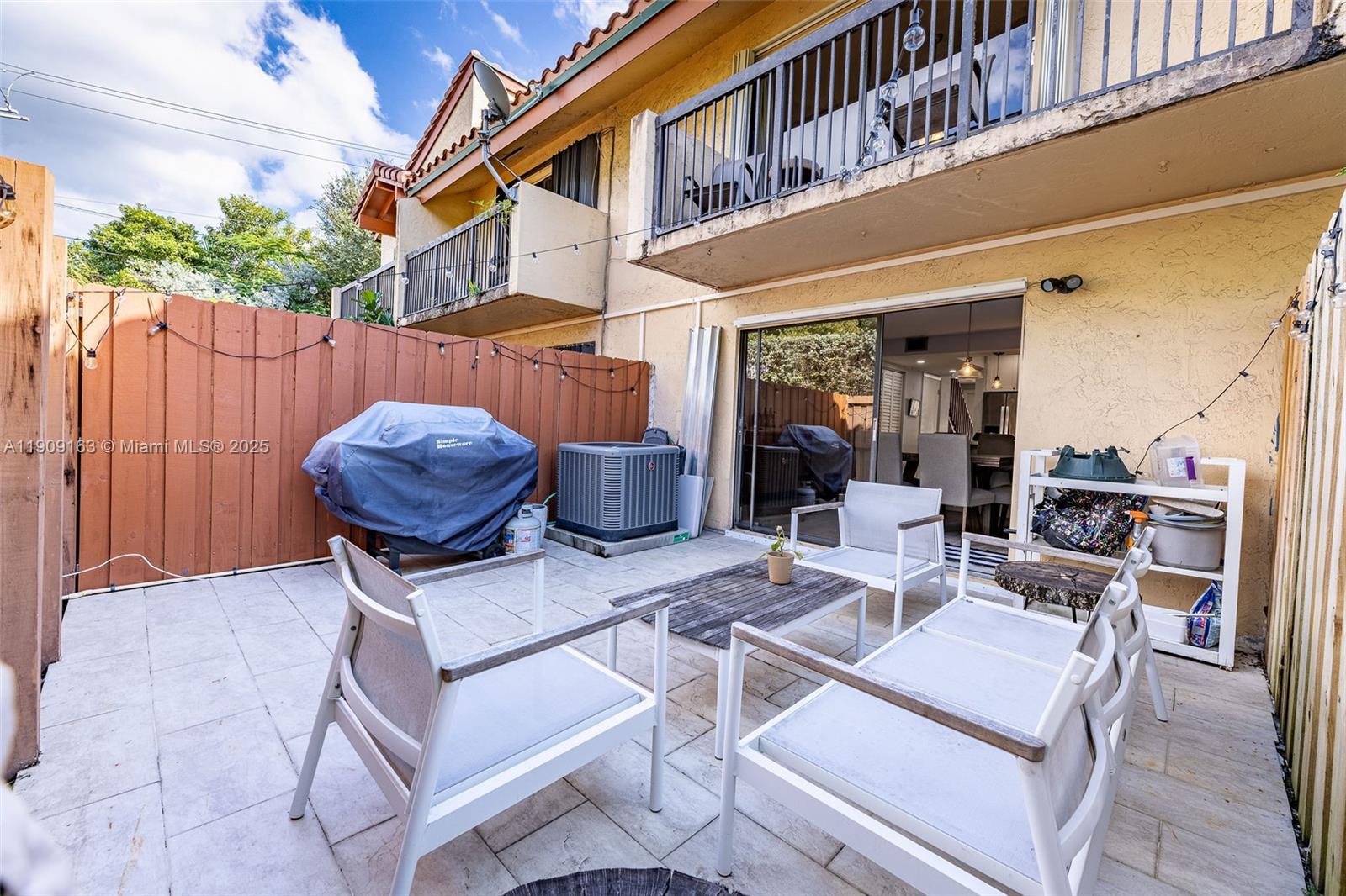 10037 Southwest 77th Court Miami, FL 33156 - Photo 20 of 70 a view of a patio with table and chairs