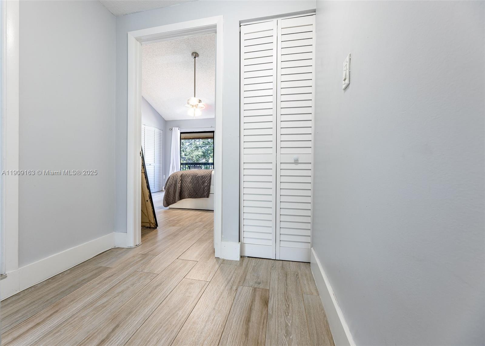 10037 Southwest 77th Court Miami, FL 33156 - Photo 23 of 70 a view of hallway with wooden floor and stairs